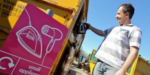 Man at recycling centre