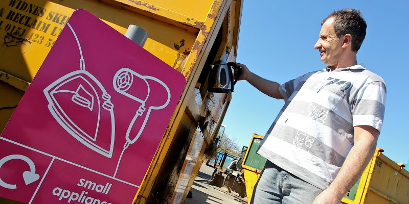 User depositing waste at a recycling centre