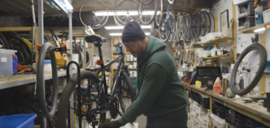 Barry Redman from MerseyCycle demonstrates how to oil a bicycle chain. Credit - MRWA / Culture City.